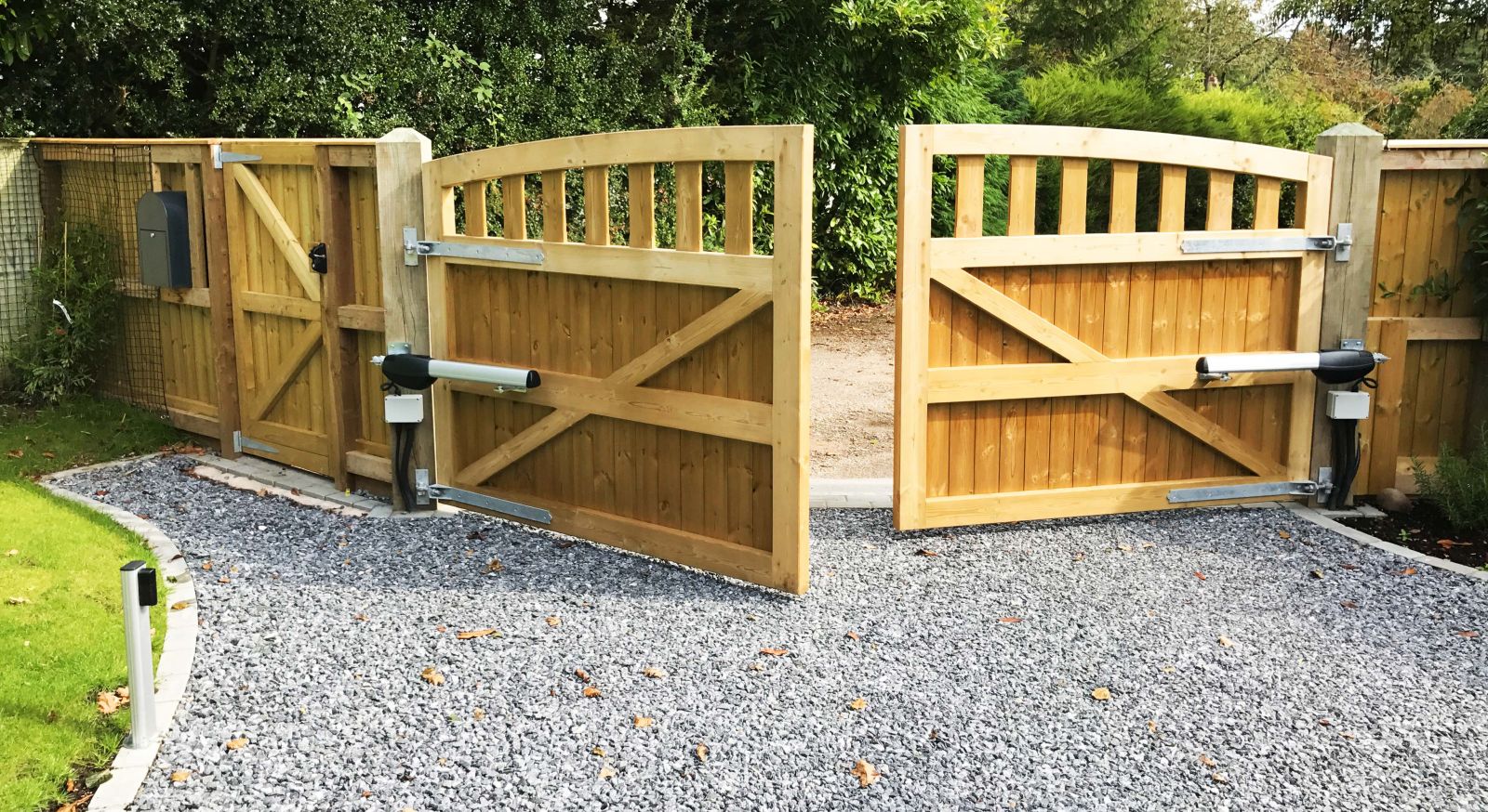 Electric gate installation technician at work